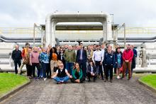 group picture in front of geothermal powerplant