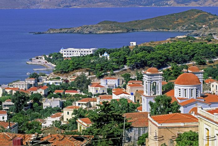 coastal view with townscape from top of hill, many trees